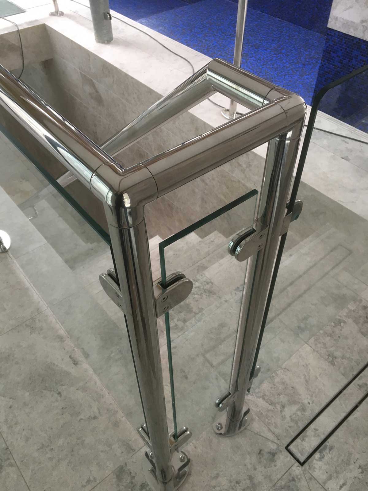 Steel staircase handrail and glazed barrier