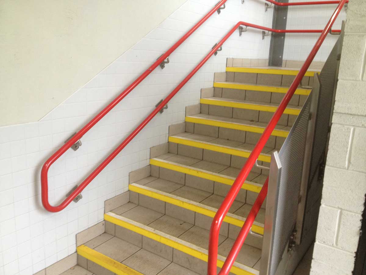 Red steel staircase handrail