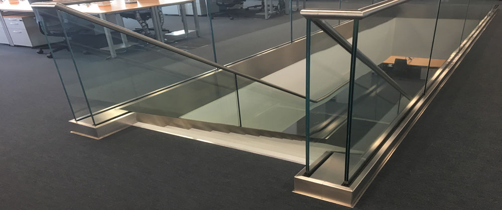 Stairway handrail with glazed panels