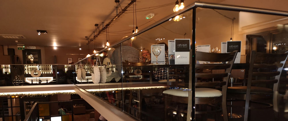 Retreat restaurant mezzanine floor, steel handrail with glazed panels